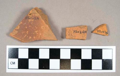 Ceramic, redware body sherds, glaze/surfaces weathered