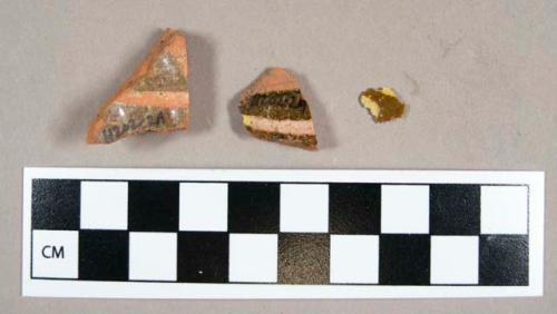 Ceramic, redware body sherds, clear glaze interior and exterior with yellow slip