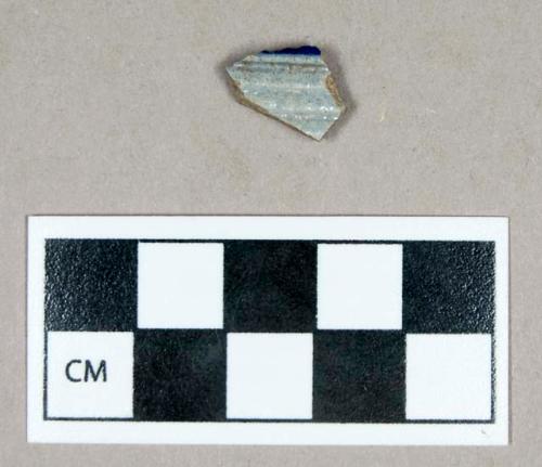 Ceramic, gray-bodied Rhenish stoneware body sherd, incised lines and cobalt blue on exterior