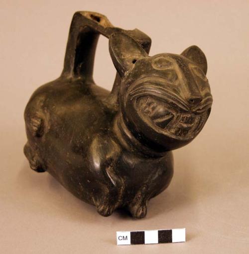 Black stirrup pot in form of fat animal