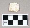 Ceramic, white salt glaze stoneware rim sherd with molded edge design