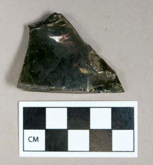 Glass, dark green bottle body fragment