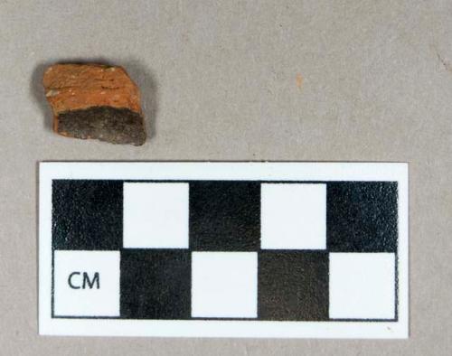 Ceramic, lead glazed redware base sherd