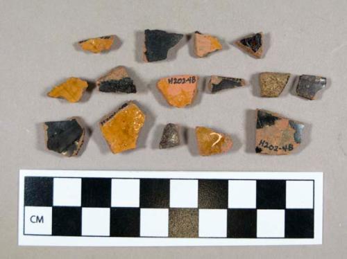 Ceramic, redware body sherds, black glazed exterior, clear glazed interior