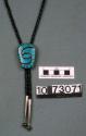 Silver and turquoise channel swirl bolo tie