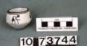 Black-on-white miniature Bowl:  figure motif