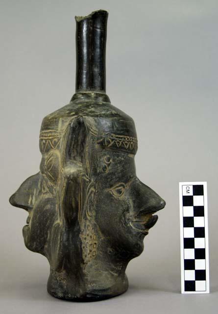 Modelled double-faced black ware jar