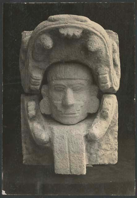 Northwest Colonnade, carved stone figure of human head in serpent's mouth