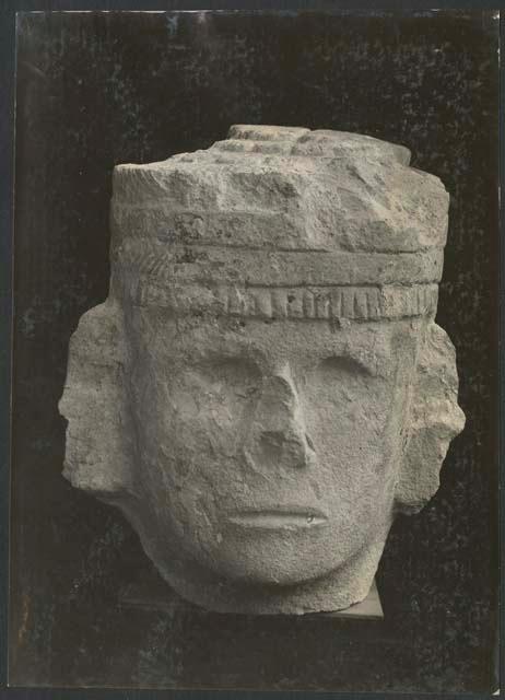 Temple of Warriors, carved stone head of Chac Mool, front view