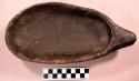 Dish, ground stone, oblong w/ small handle, black