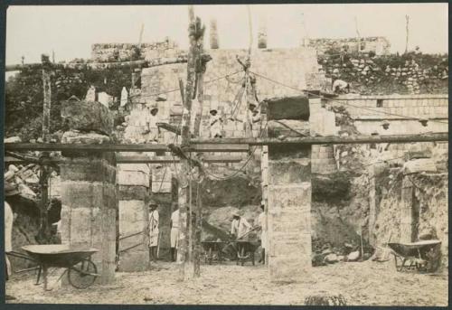 Temple of Warriors, repair of columns and excavation in front of stairway