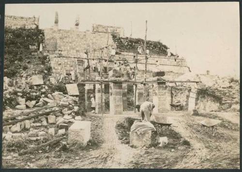 Temple of Warriors, repair of columns and excavation in front of stairway