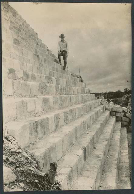 Earl H. Morris on stairs at the Temple of Warriors