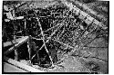 Caracol. Trench at base of upper stairway showing poles placed to prevent walls