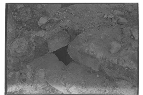 Olla under masonry block at Caracol