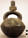 Black pottery jar, mouth and hollow handle