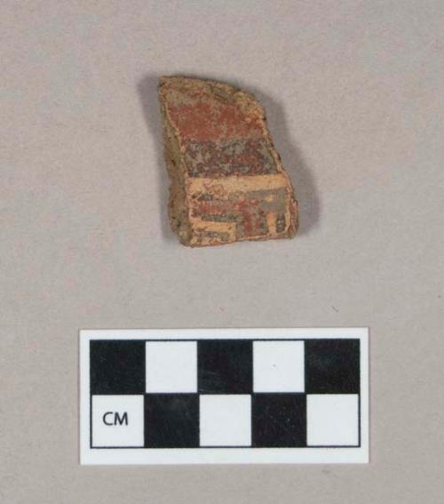 Ceramic, earthenware body sherd, red slip, black and white slipped decoration, grit-tempered