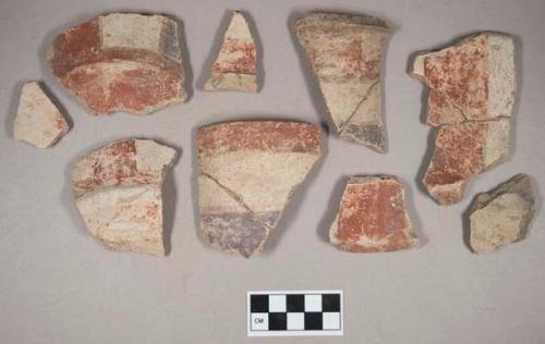 Ceramic, earthenware body, base, and rim sherds, with red, white, and purple slipped decoration, some with striped and swirled decoration, grit-tempered; some sherds crossmended with glue; some sherds crossmend