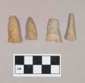 Chipped stone, three triangular projectile points, one fragmented at tip, one eared, and one drill