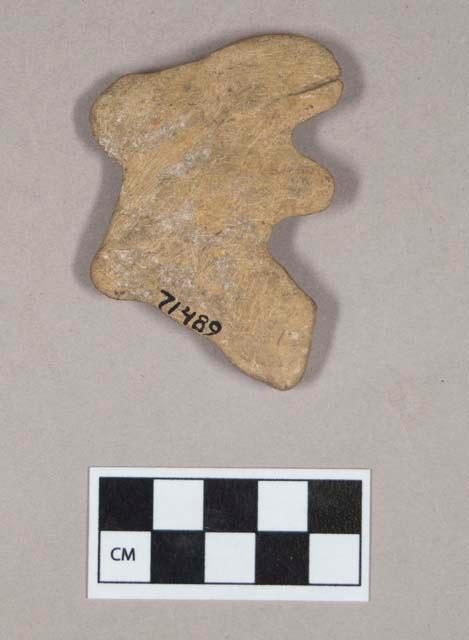 Ground stone, effigy, possible rabbit figure