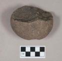 Ground stone, grooved stone fragment, possible pecked pit on one side