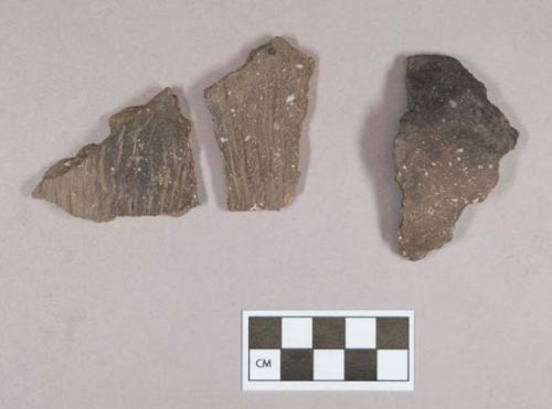 Ceramic, earthenware body sherds, one undecorated, two cord-impressed, shell-tempered; two sherds crossmend