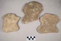 Chipped stone, edged tool fragments, possible hoes or axes, pecked notches