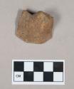 Ceramic, earthenware foot or handle sherd, undecorated, grit-tempered