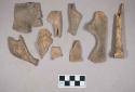 Organic, turtle bone fragments; animal bone fragments; two fragments crossmended with glue