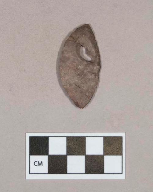 Chipped stone, biface, leaf-shaped, with possibly natural perforation; two fragments crossmended with glue