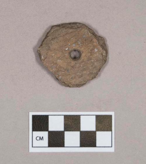 Ceramic, earthenware disc, worked from body sherd, cord-impressed, perforated, shell-tempered