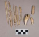 Organic, worked antler cylinder; worked animal bone perforator fragments; animal teeth