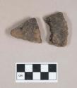 Ground stone, soapstone vessel fragments; two fragments crossmend
