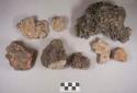 Stone fragments, some with fossilized shells; slag fragments; clay and soil fragments, some burned