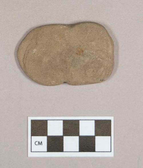 Ground stone, flat stone object, possibly notched, possibly natural