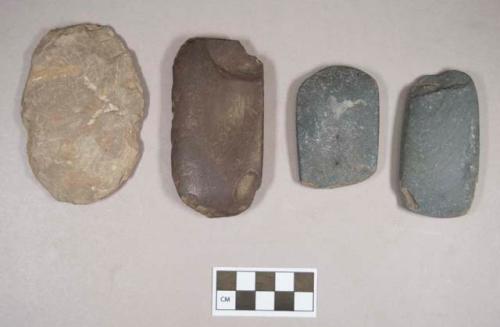 Ground stone, worked objects, three flat and rectangular with rounded edges, possible adze preforms, one flat and ovoid