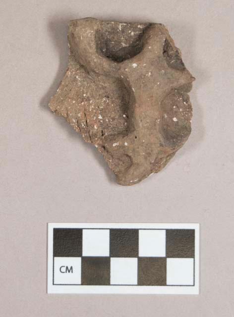 Ceramic, earthenware rim sherd with applied lizard effigy, cord-impressed body