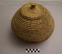 Coiled basket with flat, knobbed lid