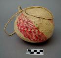 Coconut purse with woven covering