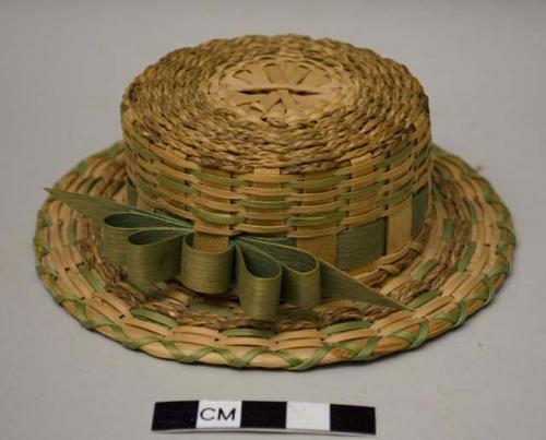 Small powder-puff box in the shape of a hat with green ribbon