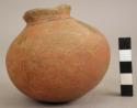 Globular red vessel with black manganese lineal design (trade piece)
