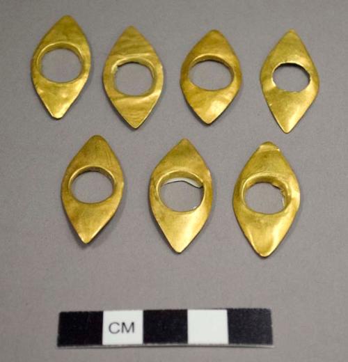 9 Gold Objects "eyes" 1" l x 1/2" w. hole in center