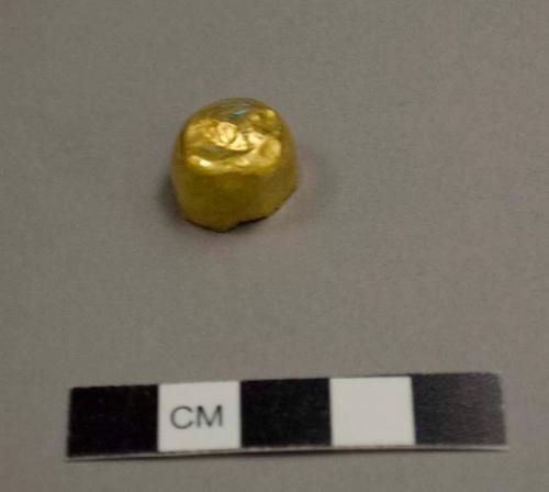 Small hemispherical gold cap