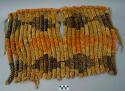 Kiekie of purple and orange dyed and natural plant fiber in a diamond pattern