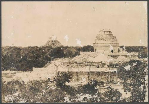 El Caracol, view from Las Monjas, tower repaired, repair of south side of lower platform