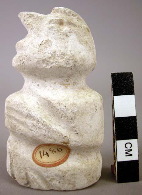 CAST, moulded and incised human figure, seated, buff, abraided