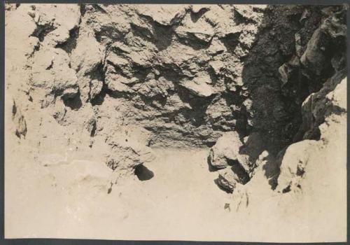 El Caracol, pit in lower section of stairway, showing floor curving up against terrace