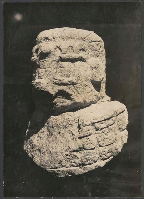 El Caracol, stone head with glyphs on shoulder from stairway trench