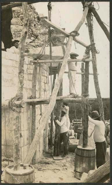 Caracol, raising block to restore in five-member cornice