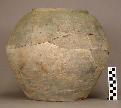 Large pottery urn - grey ware; herring bone pattern; (restored)